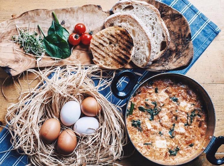 A pan of menemen with grilled sourdough