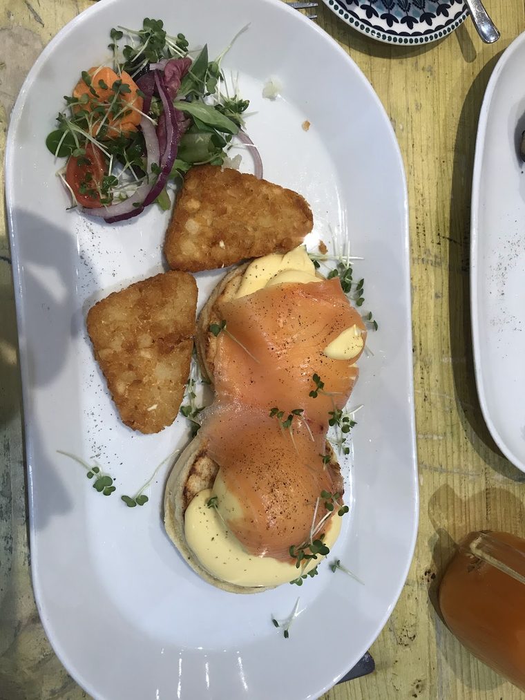Eggs benedict with fried halloumi and herb salad