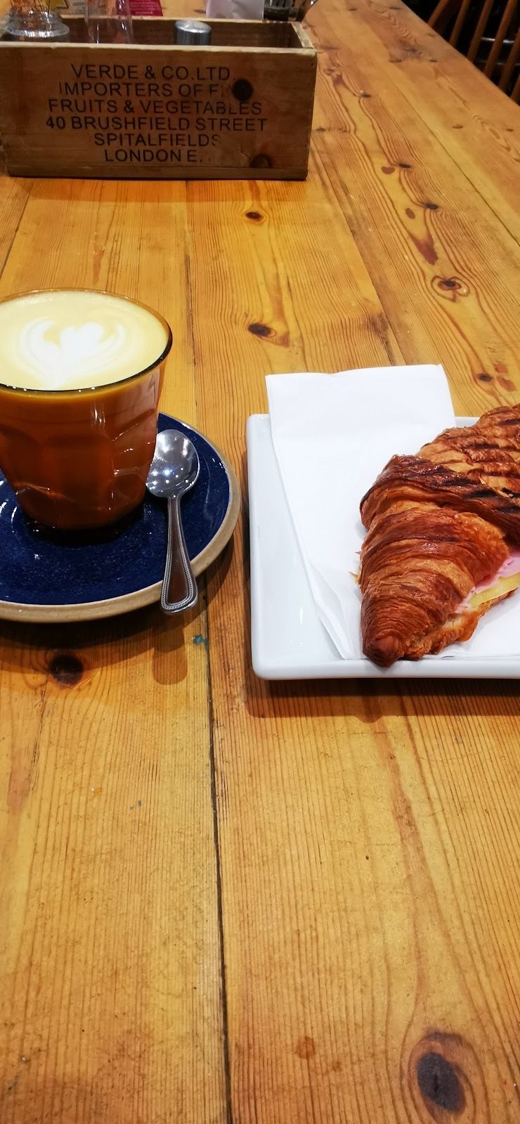 A cappuccino and a croissant